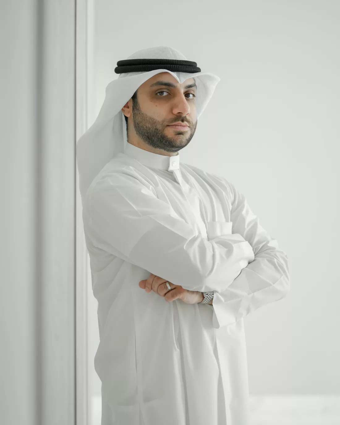 Abdullah Benayan beside a window in natural light